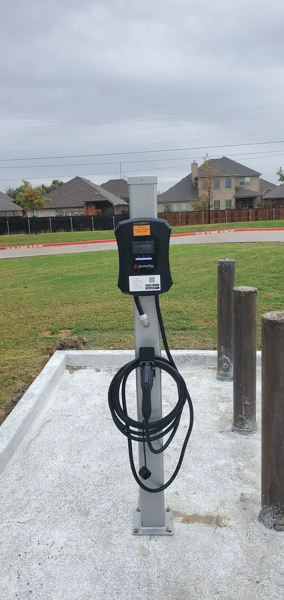 Installed PowerFlex commercial EV charging post in a parking lot