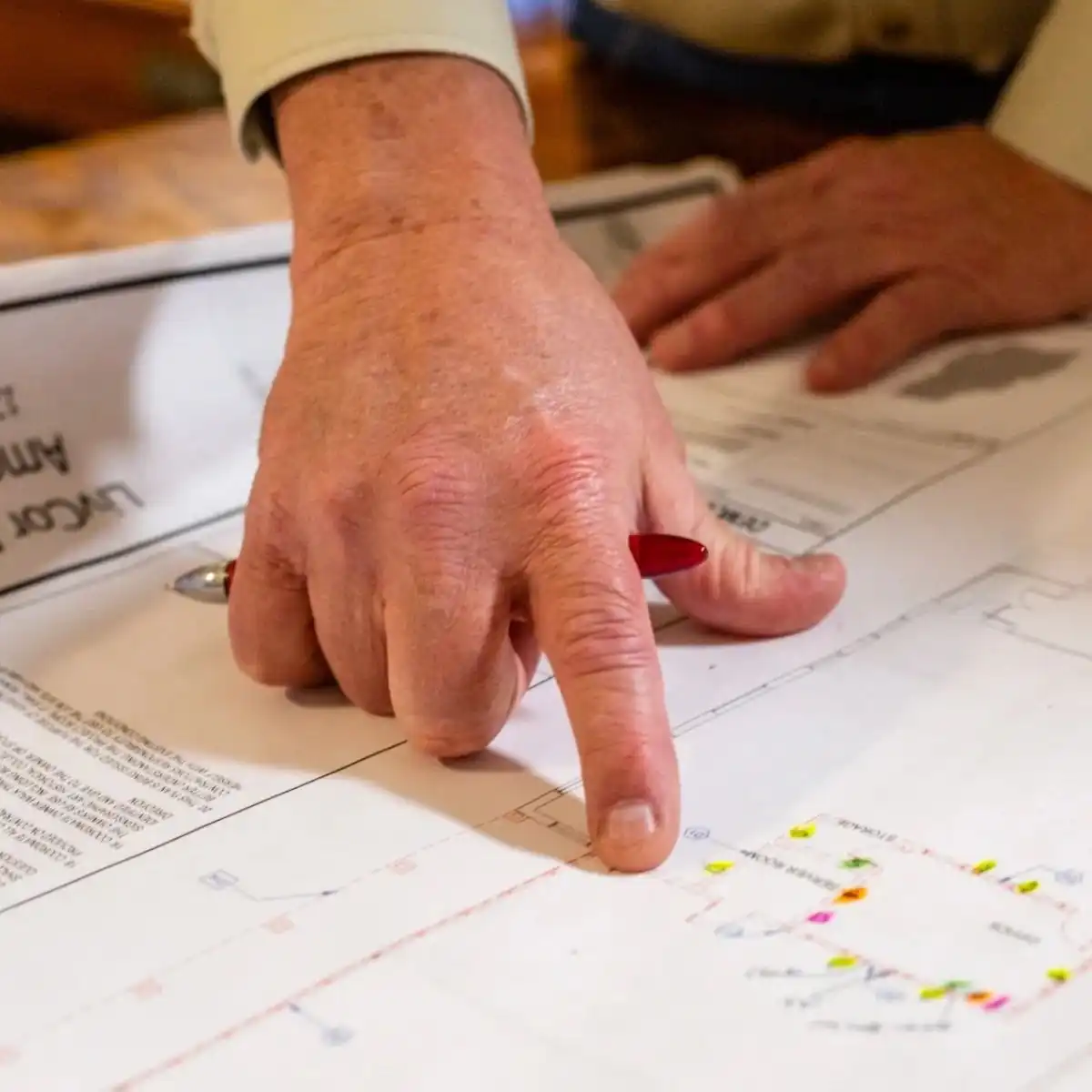 Electrical panel and circuit layout marked up on a printed new construction floor plan